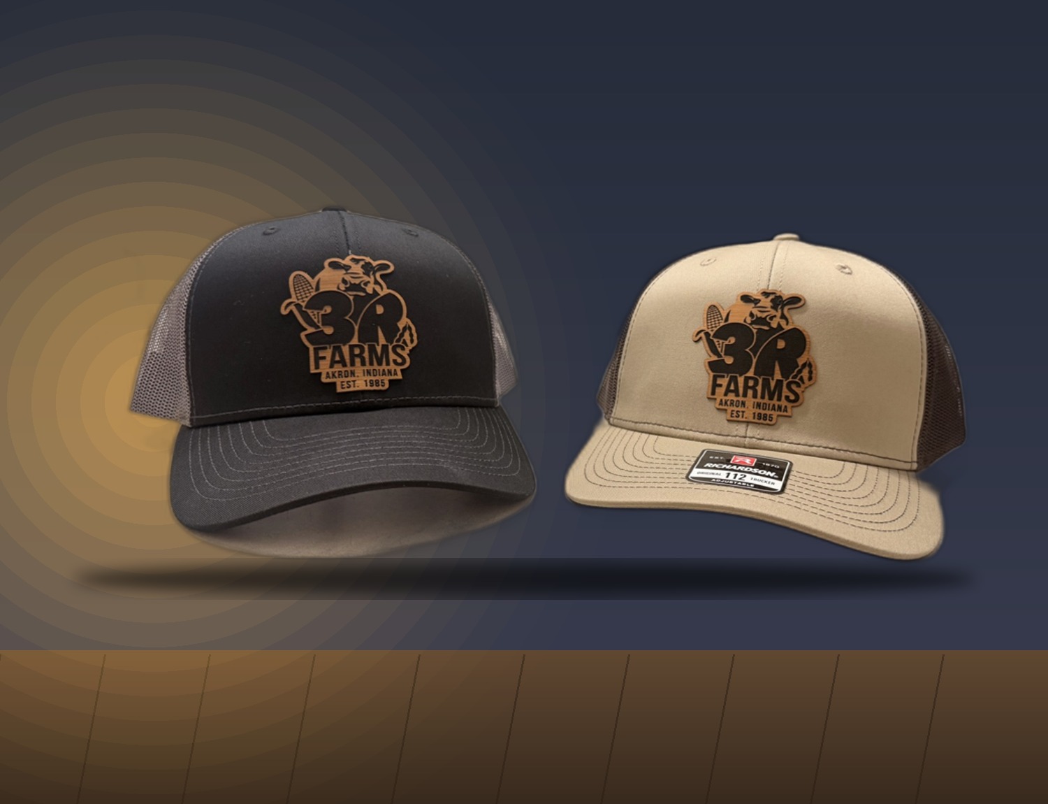 Two trucker hats with engraved leather patches for a local farm