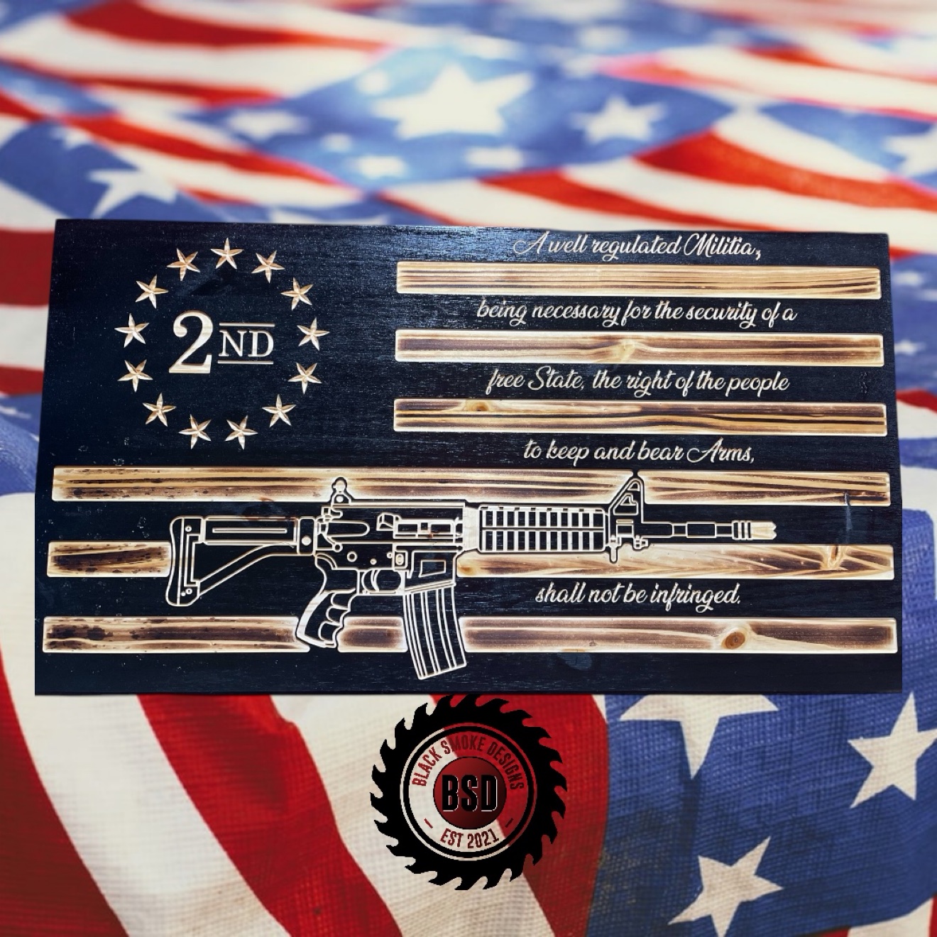 Wood flag carved with the Second Amendment and a rifle
