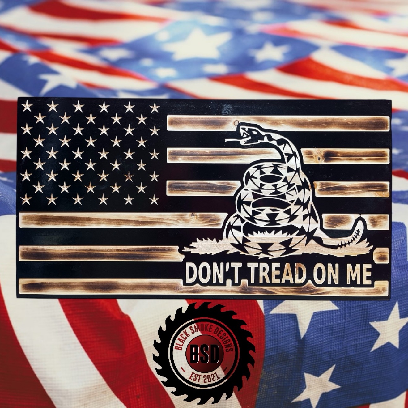 Black carved flag with Gadsden rattlesnake and Dont Tread On Me text