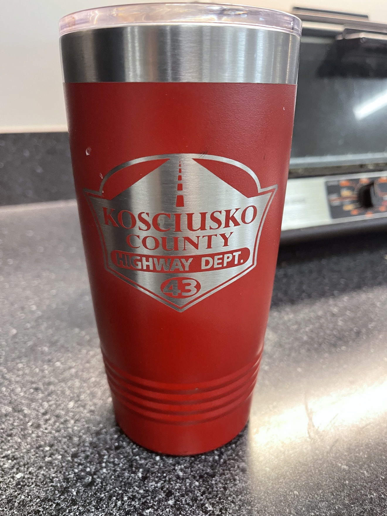 Red engraved tumbler for a county highway crew
